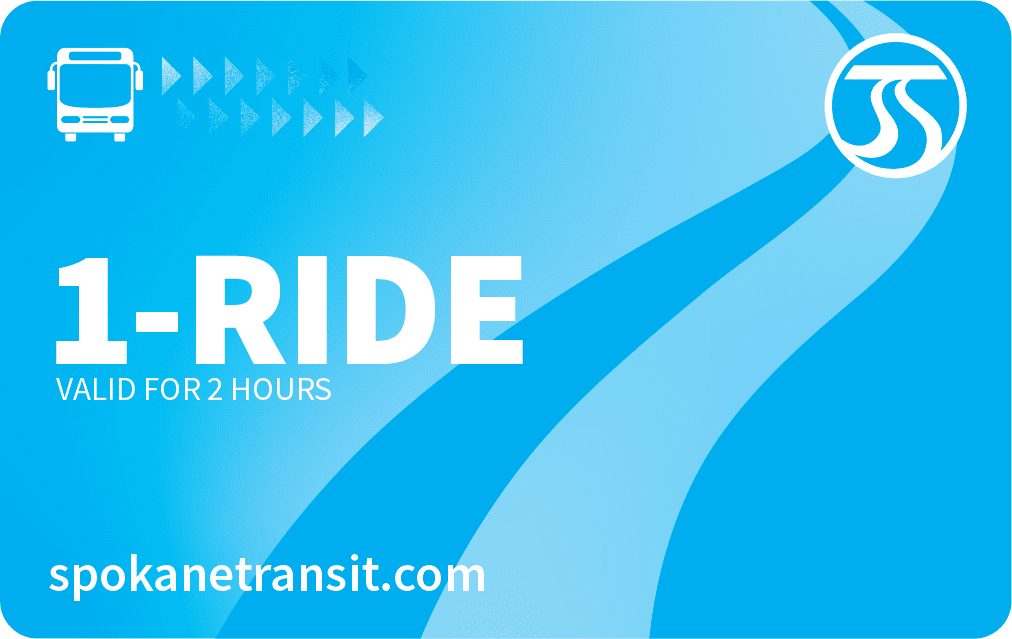 A blue Spokane Transit bus pass featuring a white bus icon, the text "1-RIDE" in large white letters, "VALID FOR 2 HOURS" below it, and the Spokane Transit logo. A curved white and light blue road graphic is in the background. Part of the STA Community Access Program. Website: spokanetransit.com.